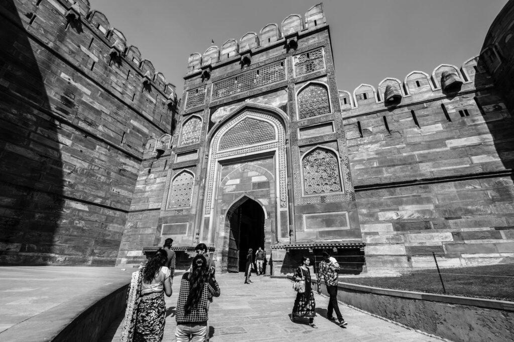 Black and White Day time View of Agra fort. A must have on every tourist list. The Red Fort of Agra serves as a major draw for tourists participating in one-day Delhi to Agra city Trip conducted by car.